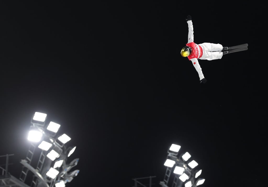 Qi Guangpu flies high in the men’s freeski aerials. Photo: Xinhua Qi Guangpu flies high in the men’s freeski aerials. Photo: Xinhua