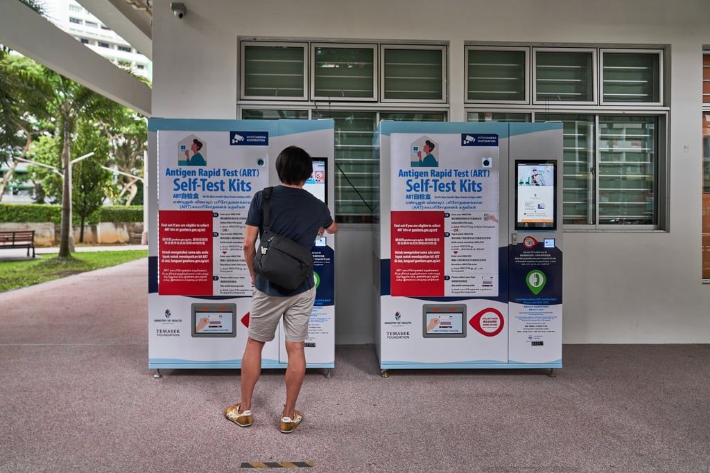 Antigen rapid testing kits are seen being sold from vending machines in Singapore. Photo: Bloomberg