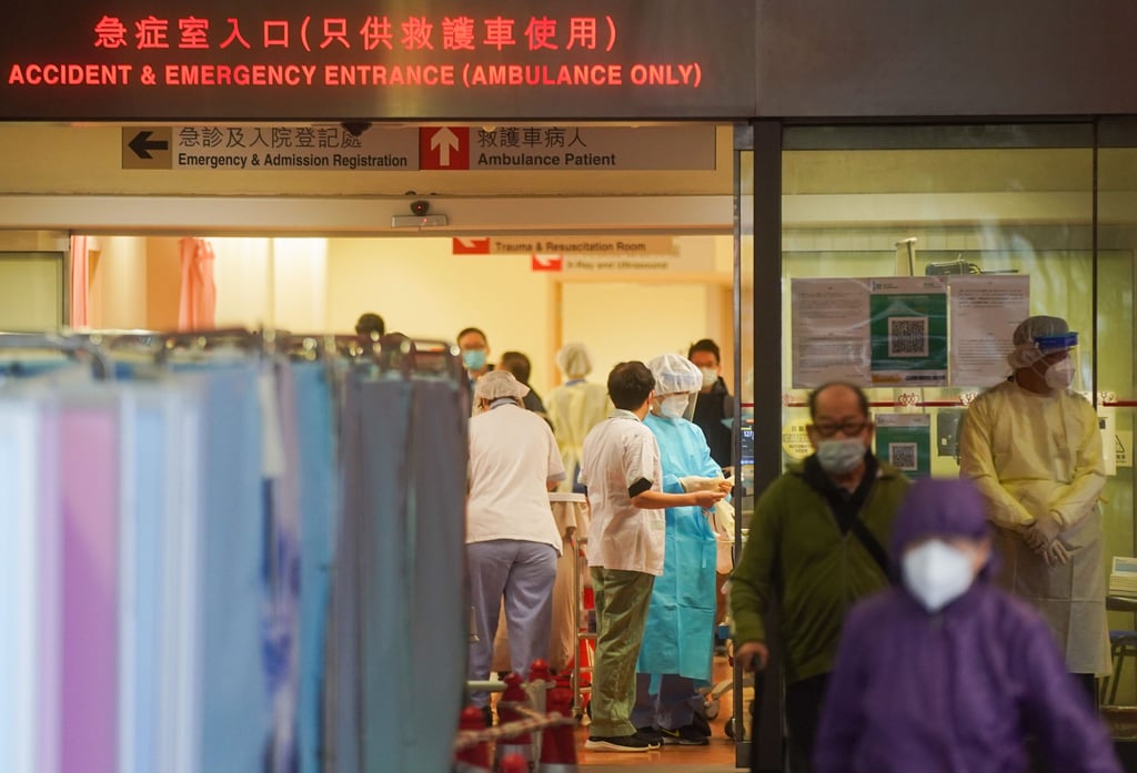 Patients with Covid-19 symptoms wait at a temporary holding area outside Prince of Wales Hospital in Sha Tin on Thursday. Photo: Sam Tsang