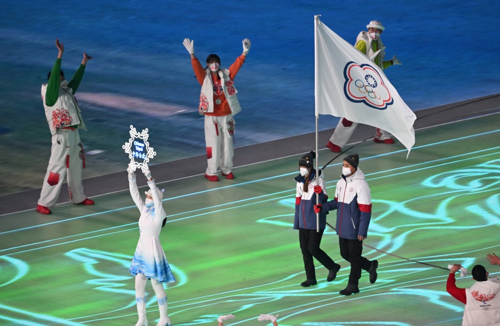 Two Taiwanese athletes carry the Chinese Taipei Olympic flag as part of the opening ceremony of the Beijing 2022 Winter Olympics on February 4. Photo: Zentralbild/dpa