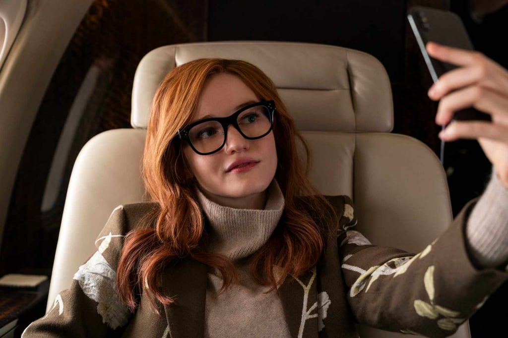 Anna Delvey (Julia Garner) snaps a selfie in a scene from Inventing Anna. Photo: Netflix Anna Delvey (Julia Garner) snaps a selfie in a scene from Inventing Anna. Photo: Netflix