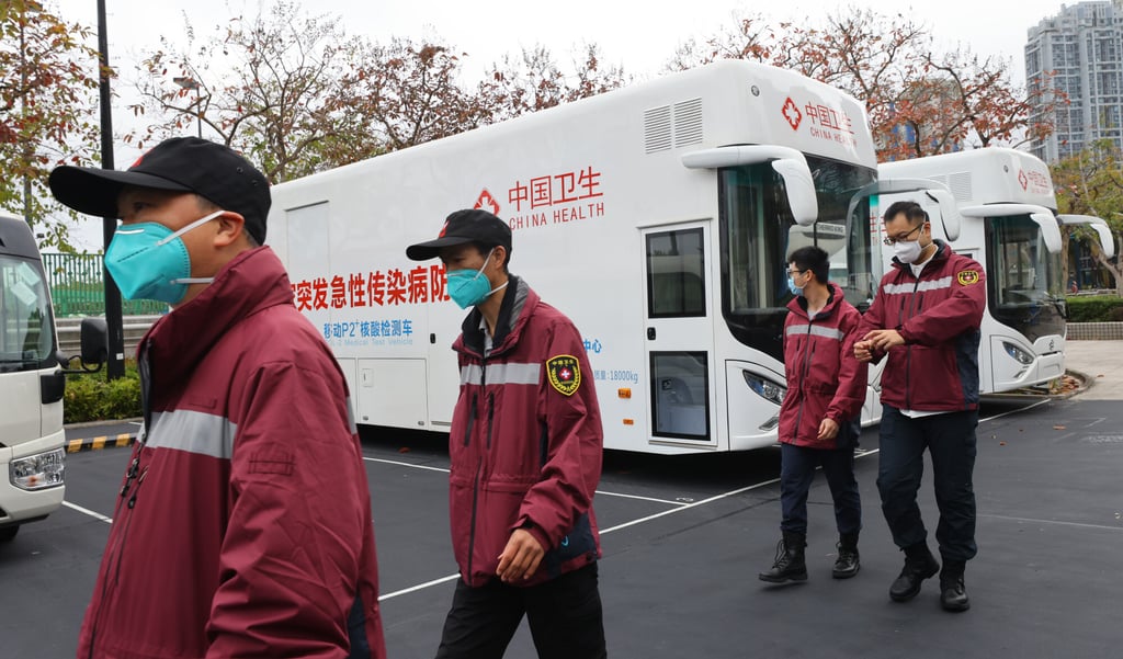 Mainland medical experts inspect a laboratory set up at the Ma On Shan Sports Centre in Ma On Shan on Friday. Photo: Dickson Lee