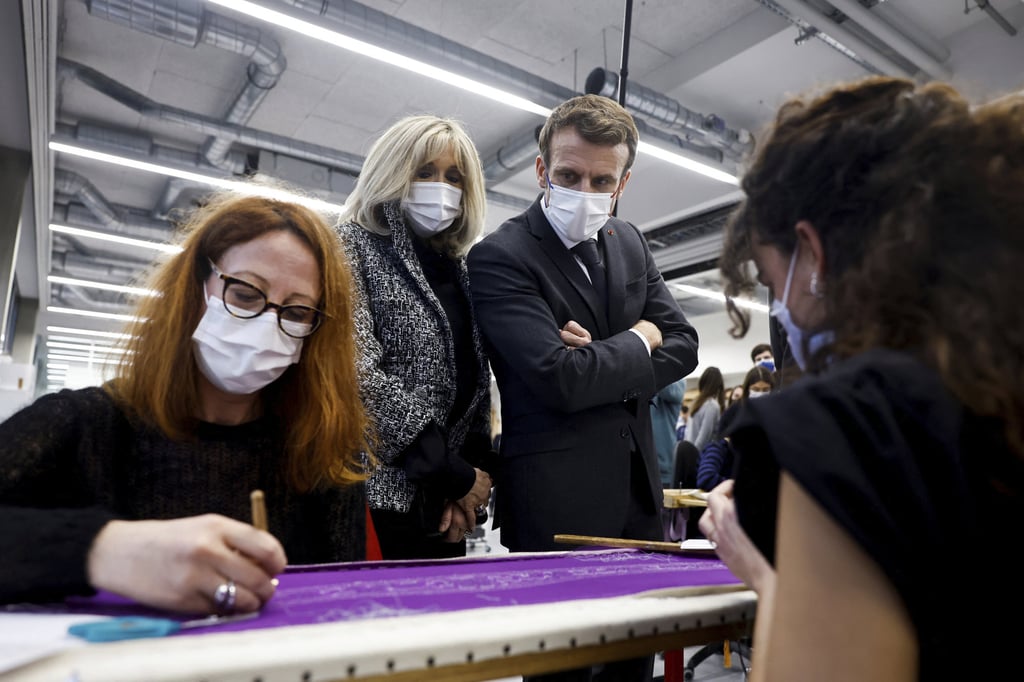 French President Emmanuel Macron and his wife, Brigitte Macron, visit Chanel’s Metiers d’Art workshops in Paris in January. Photo: AP