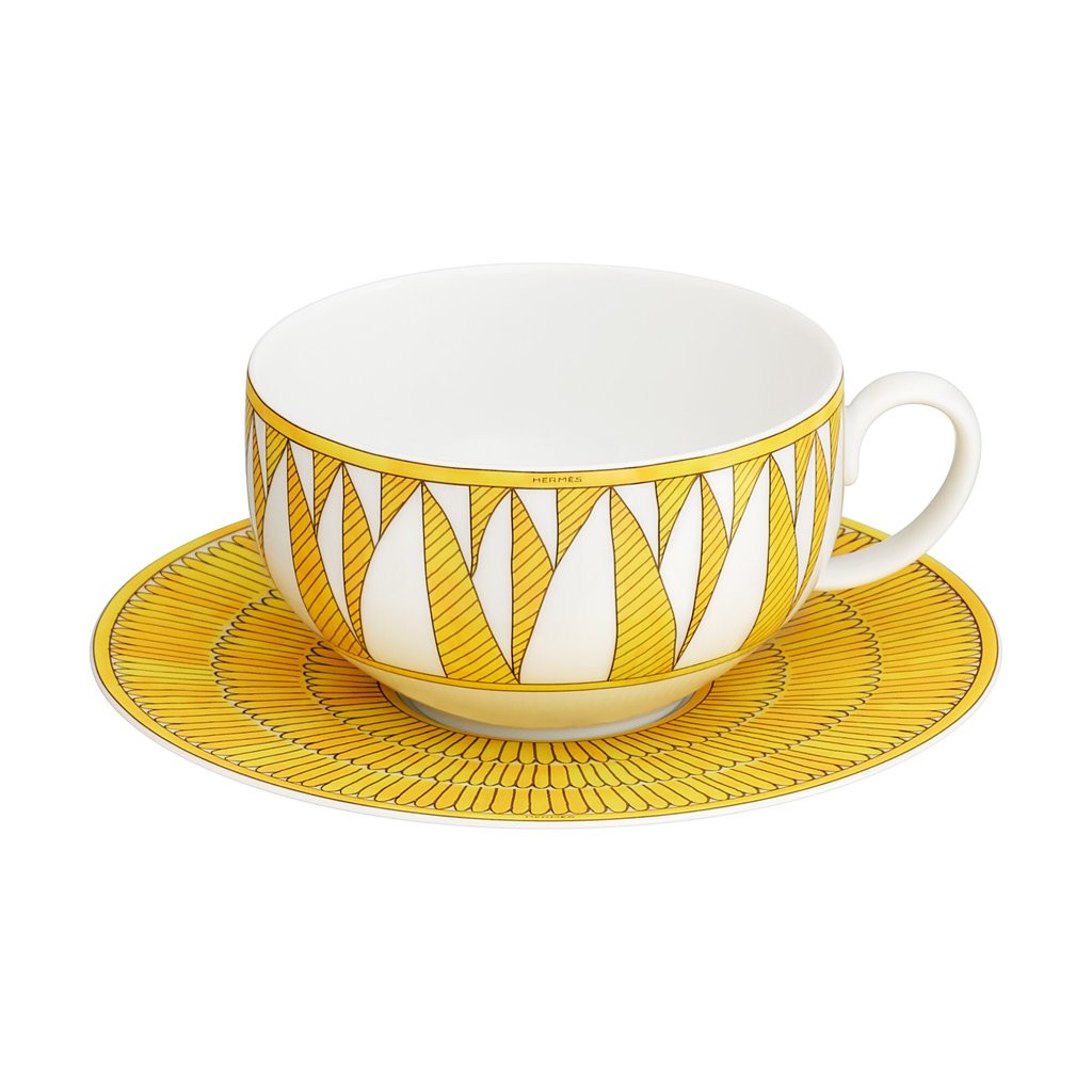 Soleil d’Hermès breakfast cup and saucer share the palm frond theme of the sugar bowl. Soleil d’Hermès breakfast cup and saucer share the palm frond theme of the sugar bowl.