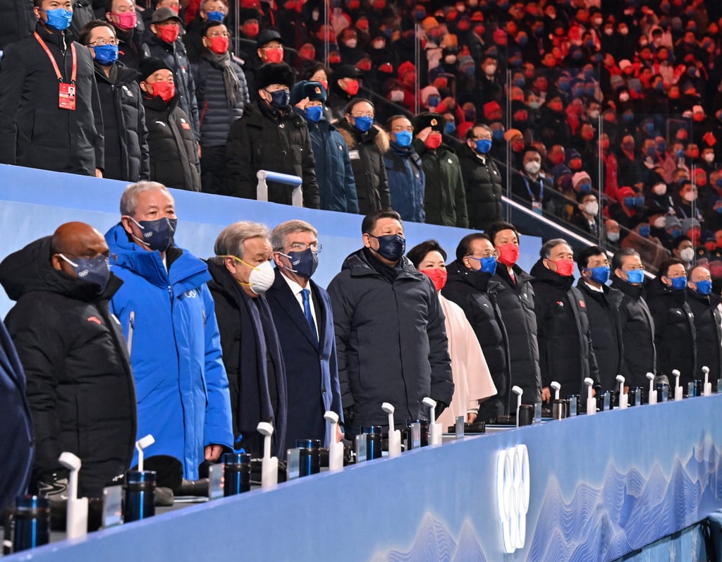 China’s President Xi Jinping, fifth from left, stands alongside government officials and guests, including International Olympic Committee (IOC) president Thomas Bach, during the opening ceremony. Photo: Getty Images