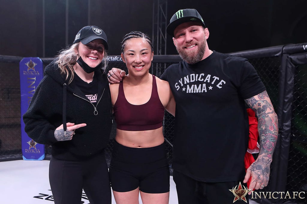 Ramona Pascual (centre) flanked by Syndicate MMA’s John and Joanne Wood. Photo: Handout