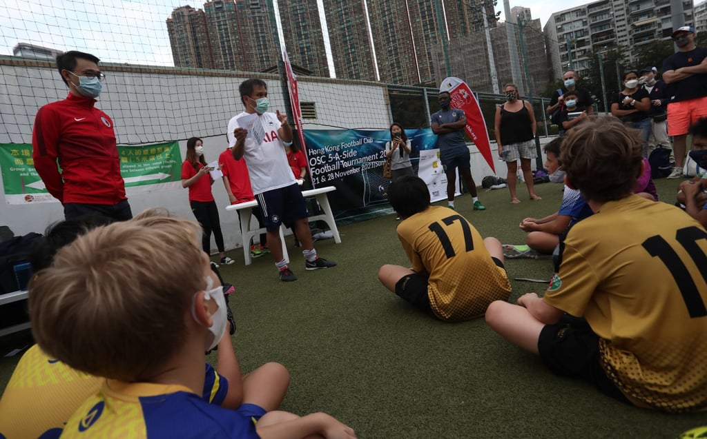 Hong Kong Football Association CEO Joaquin Tam (left) at an Operation Santa Claus event at Happy Valley in November 2021. Photo: Jonathan Wong