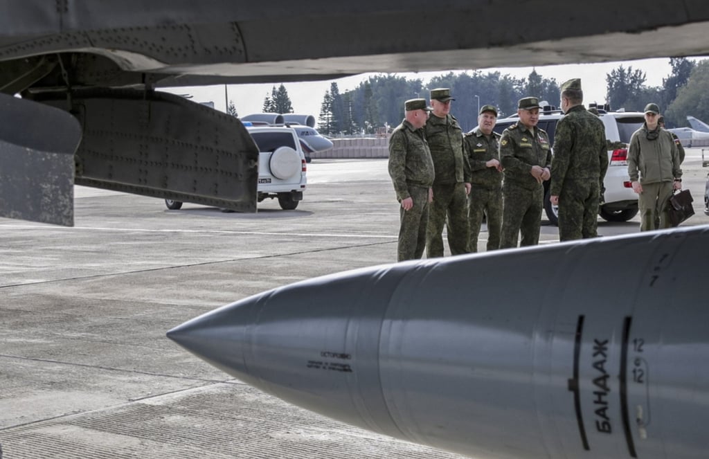 Russia’s defence minister and other officials inspect a Russian airbase near Latakia, Syria earlier this month. Photo: EPA