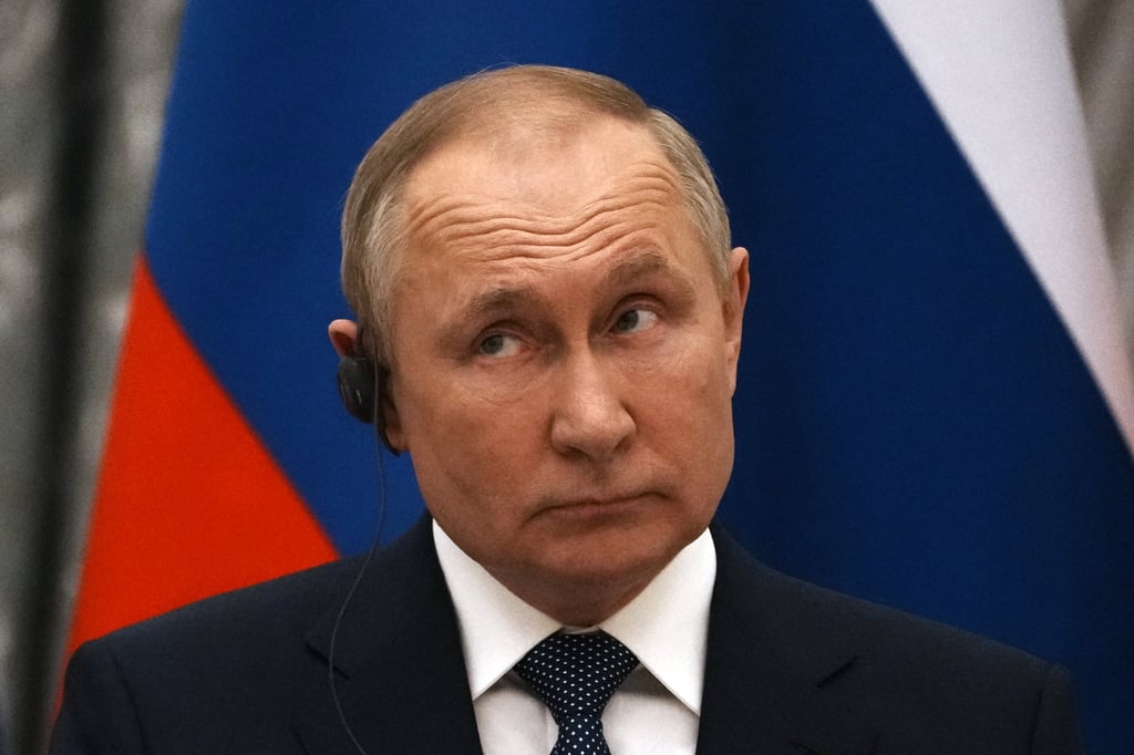 Russian President Vladimir Putin reacts during a joint press conference with French President Emmanuel Macron after their talks in Moscow, Russia, on February 7, 2022. Photo: AP/Pool