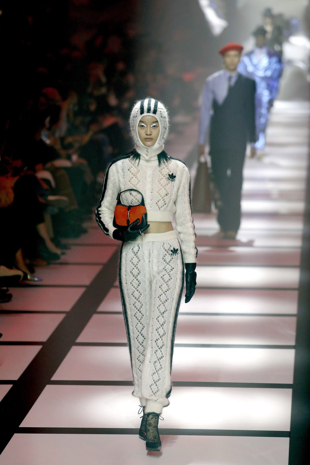 It finally happened Gucci and Adidas collaboration at Milan Fashion Week 2022 featured athletic style dresses and suits with Rihanna A AP Rocky and Stan Smith gracing the front row South China