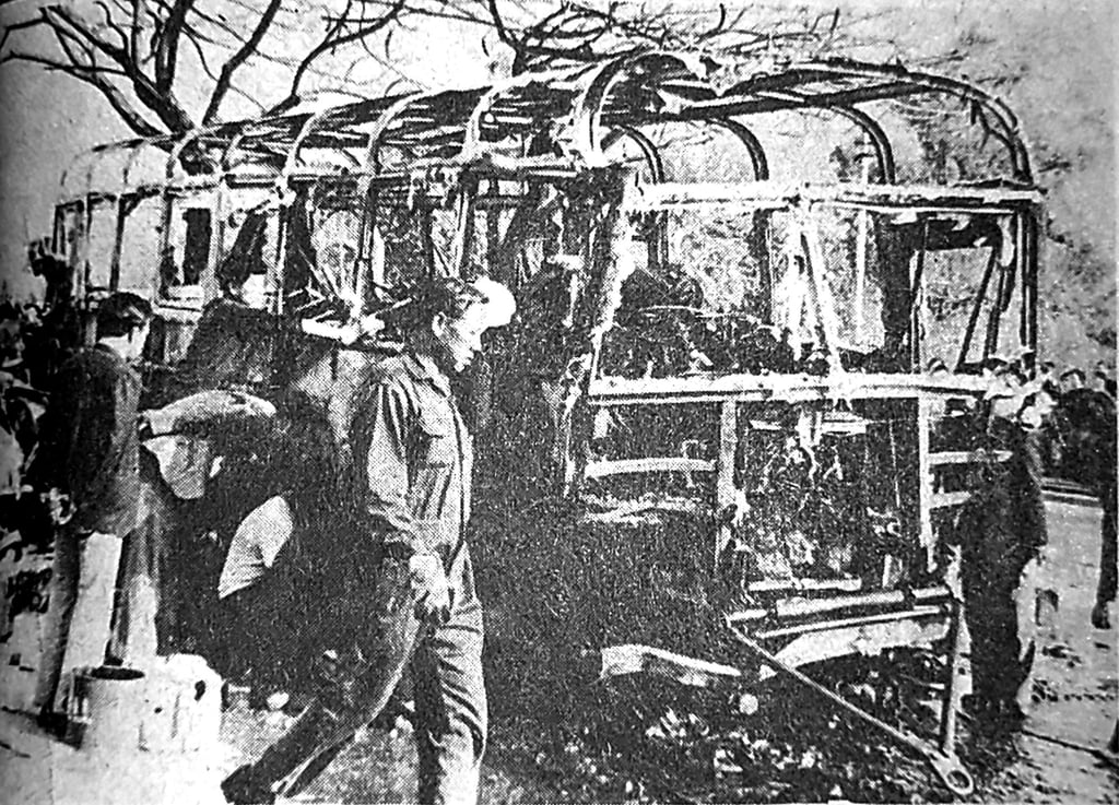 KMB officials examine the burnt-out bus. Photo: SCMP