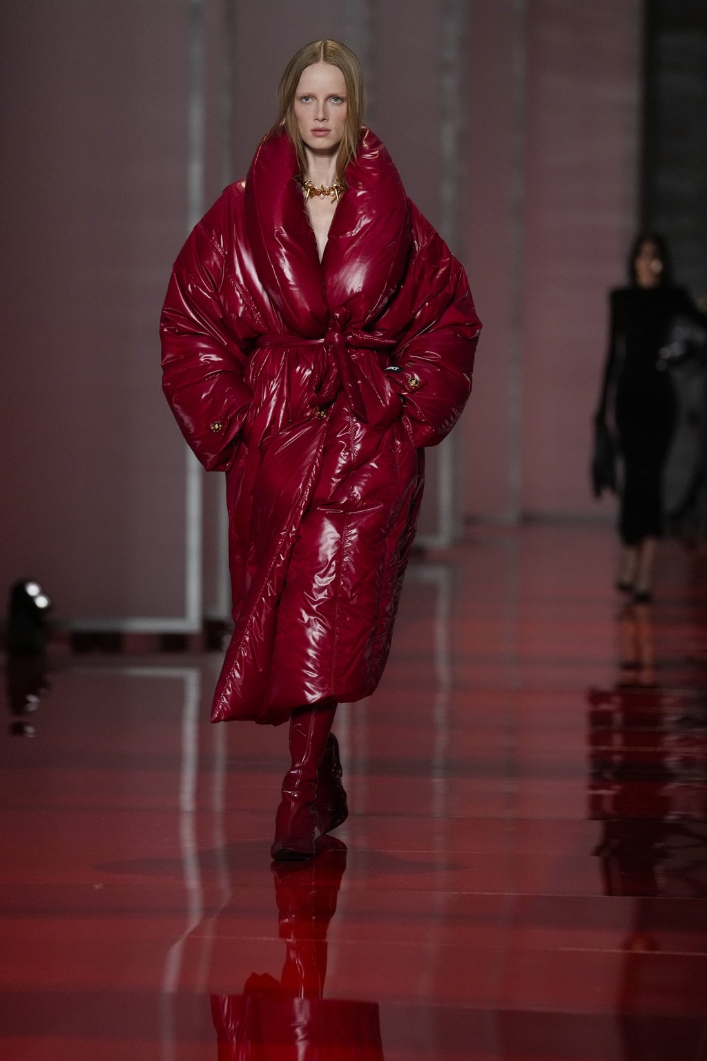 A model wears a statement red puffer coat as part of the Versace autumn/winter 2022-23 collection during Fashion Week in Milan, Italy, on February 25. Photo: AP Photo A model wears a statement red puffer coat as part of the Versace autumn/winter 2022-23 collection during Fashion Week in Milan, Italy, on February 25. Photo: AP Photo