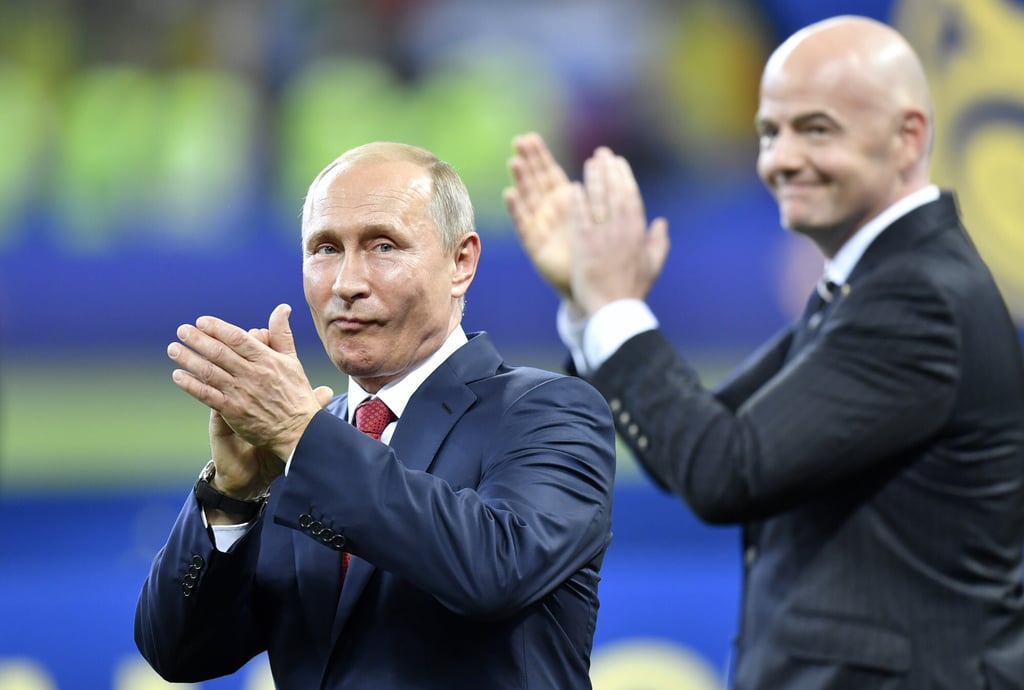 Russian President Vladimir Putin (left) applauds beside Fifa president Gianni Infantino at the end of the 2018 World Cup final between France and Croatia in the Luzhniki Stadium in Moscow. Photo: AP