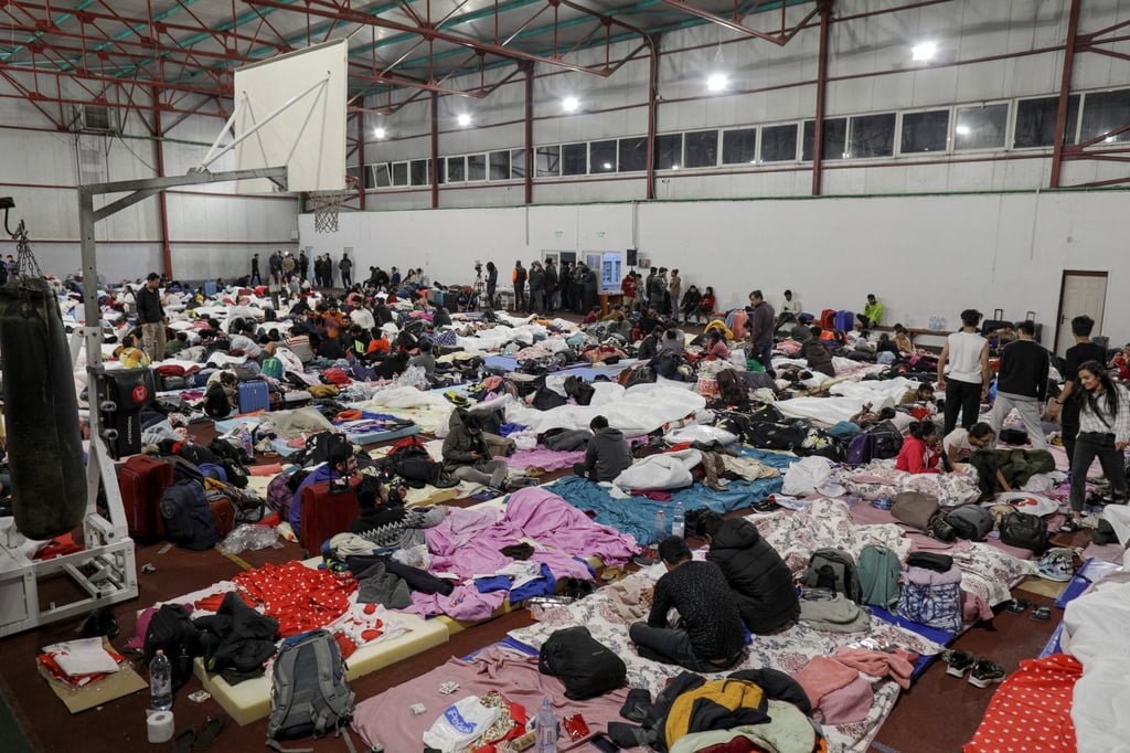 Indian students that fled Ukraine rest in a sports hall in Romania. Photo: Inquam Photos via Reuters