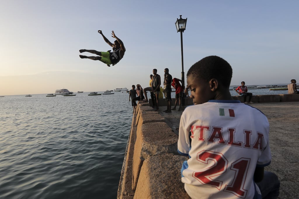A diver does a stunt at a harbour regularly visited by tourists in Zanzibar, Tanzania. File photo: EPA-EFE