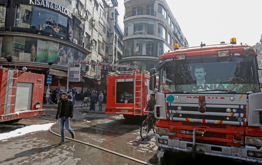 Firefighters at the scene of a fatal blaze that broke out in the Syrian capital Damascus in the early hours of Tuesday. Photo: AFP
