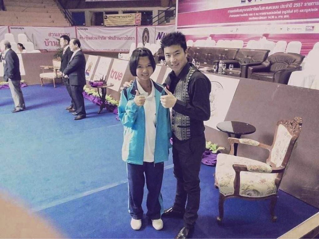 A young Nutcharut ‘Mink’ Wongharuthai with her first coach ‘Big Saraburi’ in 2014. Photo: Handout