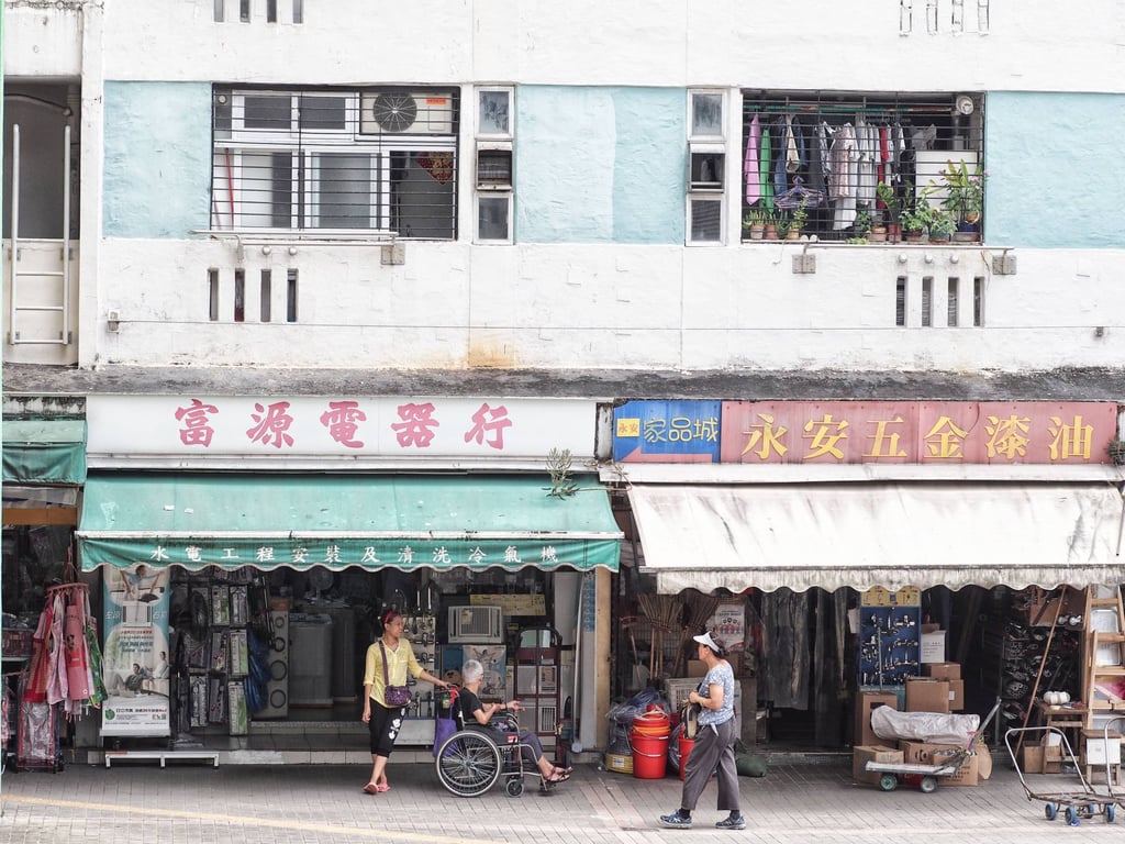 Helpers who push the elderly in wheelchairs ease the burden on couples taking care of parents. Photo: Manami Okazaki