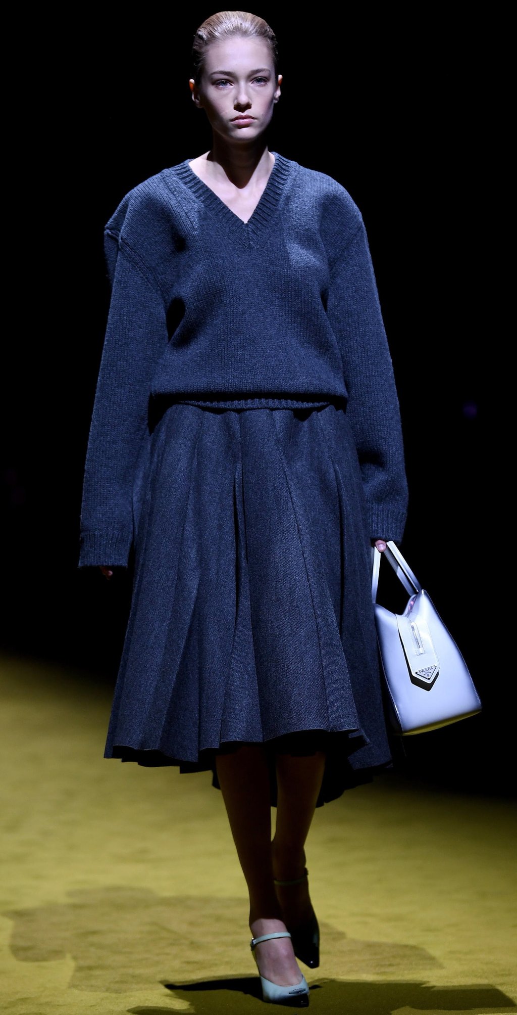 A model wears a matching skirt and jumper from Prada. Photo: EPA