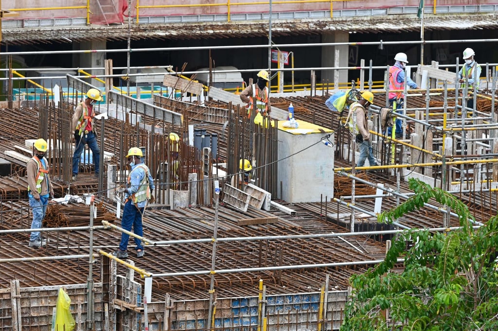 Migrant workers work on a construction site in Singapore. Photo: AFP
