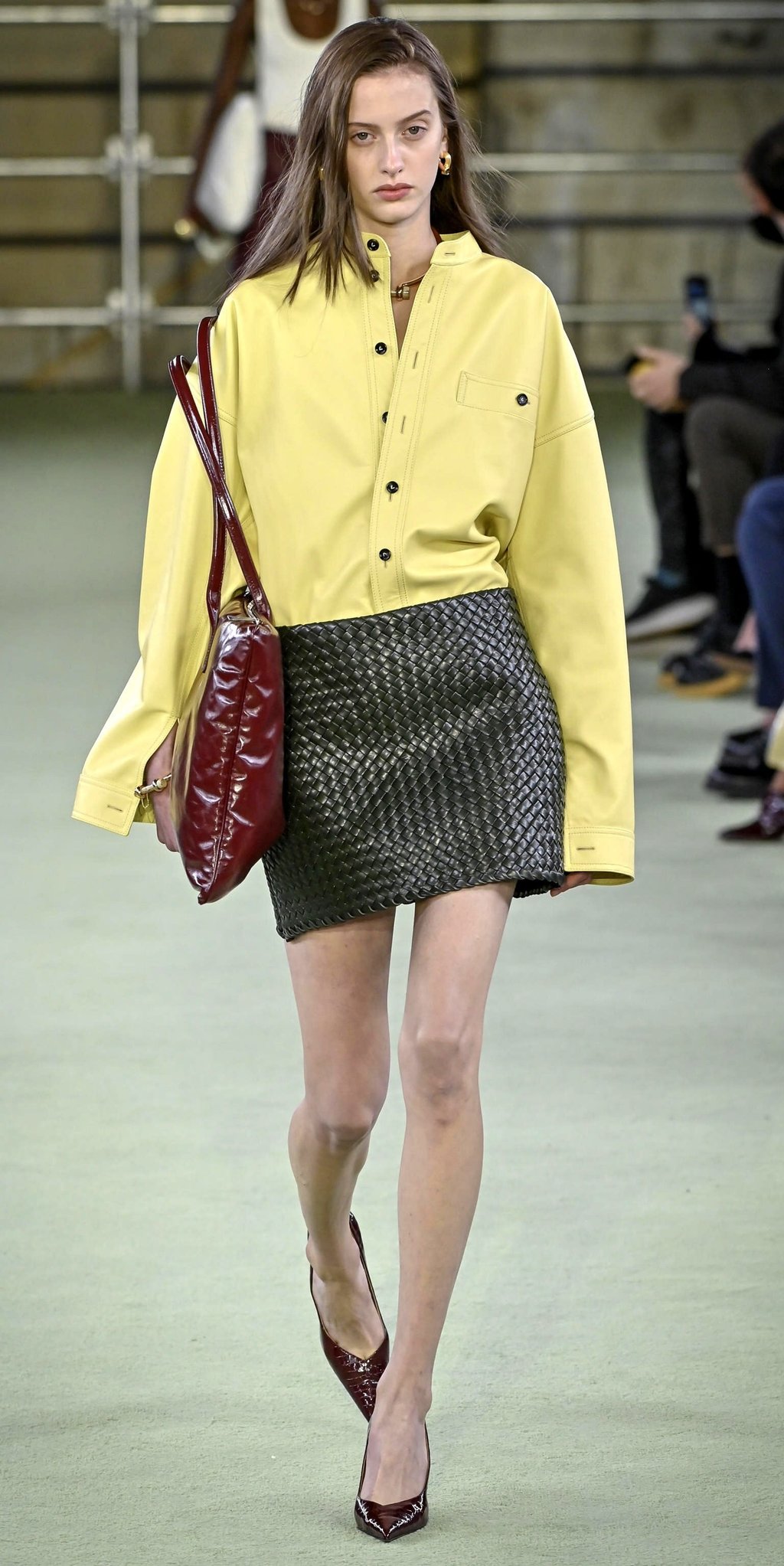 A model wears bold yellow with a patterned skirt at the Bottega Veneta women’s catwalk show autumn/winter 2022-2023 on the fifth day of the Milan Fashion Week in Milan, on February 26. Photo: EPA-EFE