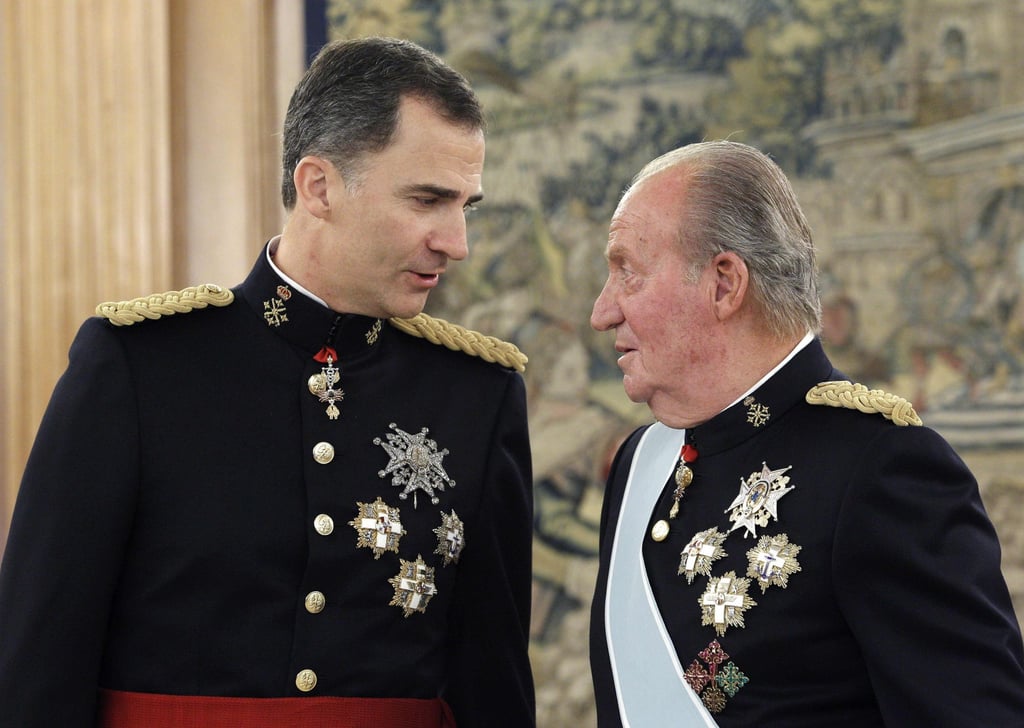 Spain’s King Felipe (left) and his father, former king Juan Carlos, attend a ceremony at Zarzuela Palace in June 2014. Photo: AFP
