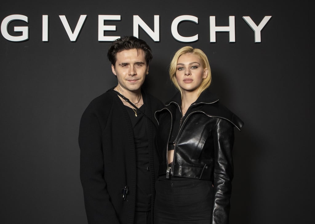 Brooklyn Beckham, left, and Nicola Peltz pose for photographers before the Givenchy spring/summer 2022 show. Photo: AP