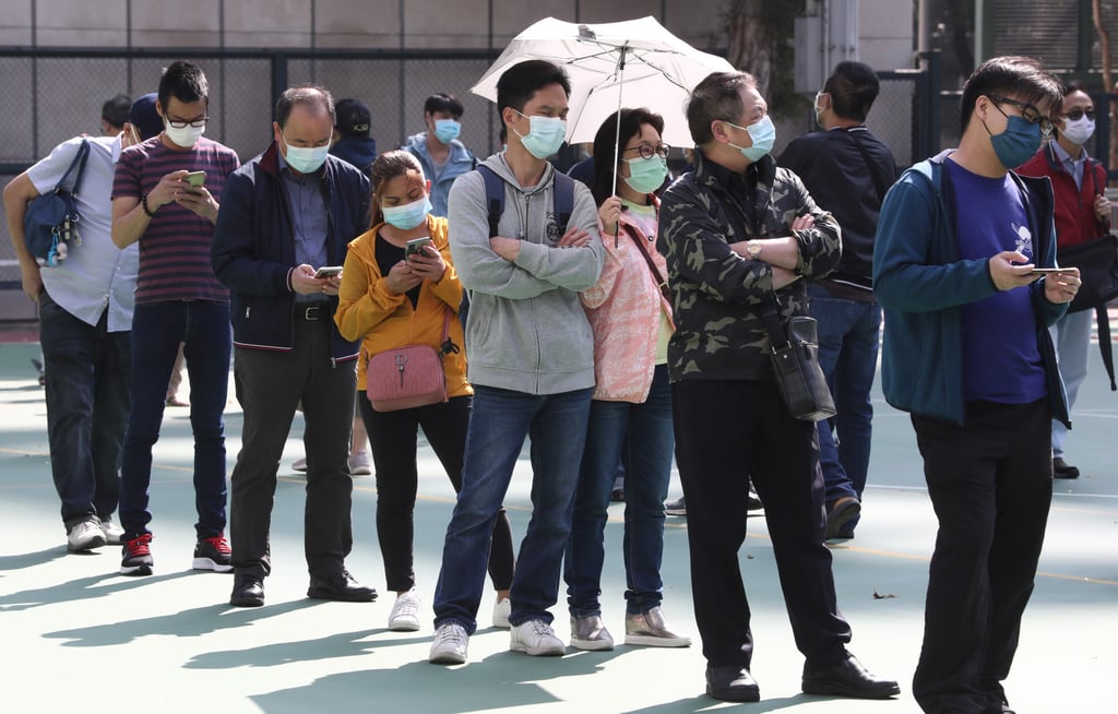 Residents queue for Covid-19 testing at a mobile specimen collection station in Mong Kok on Friday. Photo: Jonathan Wong Residents queue for Covid-19 testing at a mobile specimen collection station in Mong Kok on Friday. Photo: Jonathan Wong