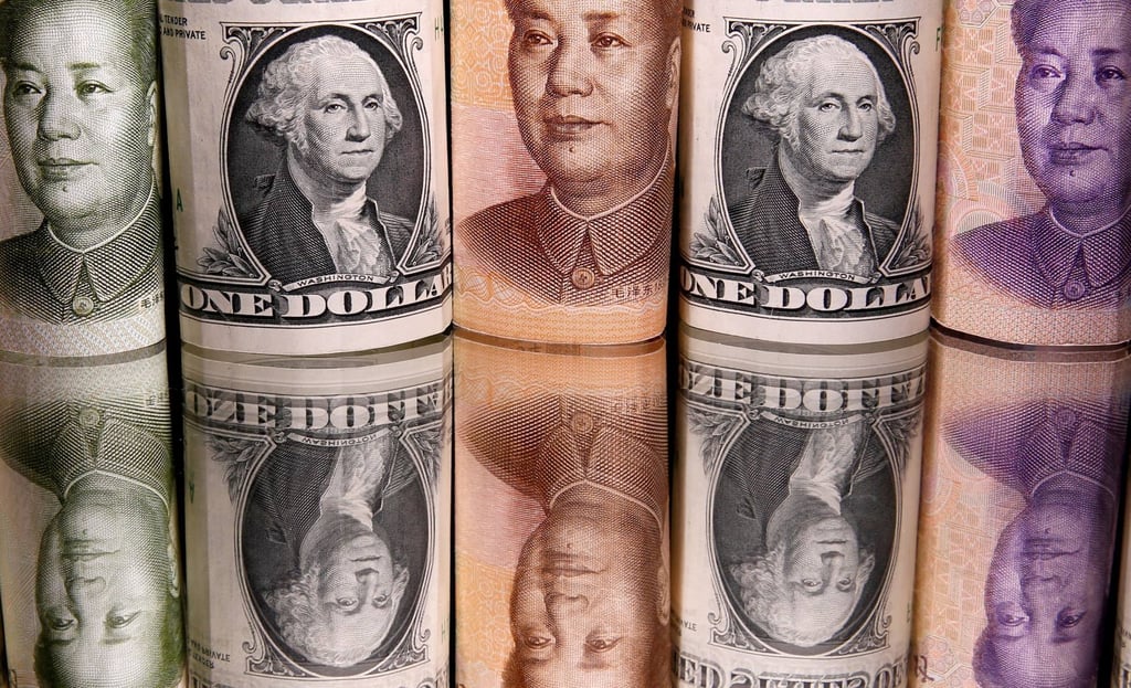 Chinese yuan and US dollar banknotes. Photo: Reuters