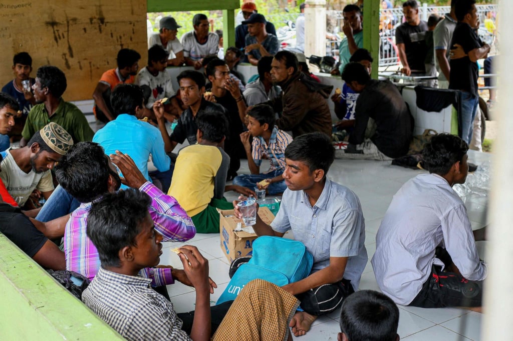 Rohingya refugees rest in the compounds of a mosque following their arrival by boat in Bireuen, Aceh province. Photo: AFP Rohingya refugees rest in the compounds of a mosque following their arrival by boat in Bireuen, Aceh province. Photo: AFP
