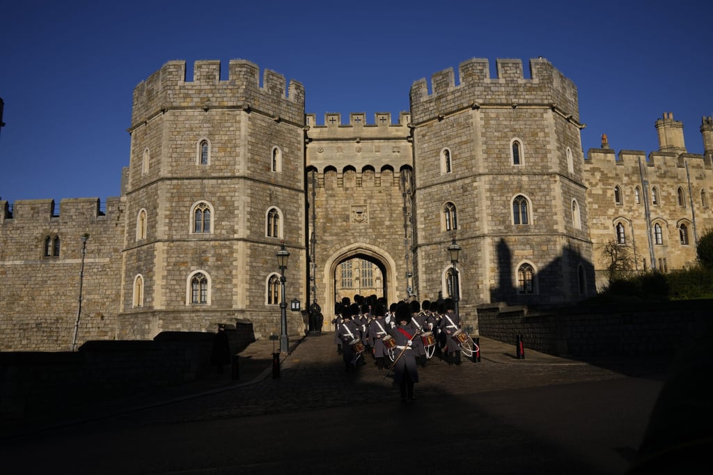 Members of the British military’s 1st Battalion Grenadier Guards Corps of Drums take part in the changing of the guard ceremony outside Windsor Castle. Photo: AP