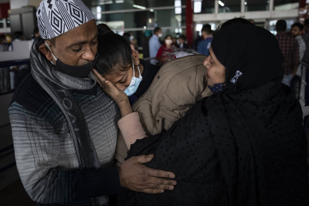 Parents hug Iqra Praveen, an Indian youngster studying in Ukraine who managed to flee the conflict and arrived home in recent days. File photo: AP