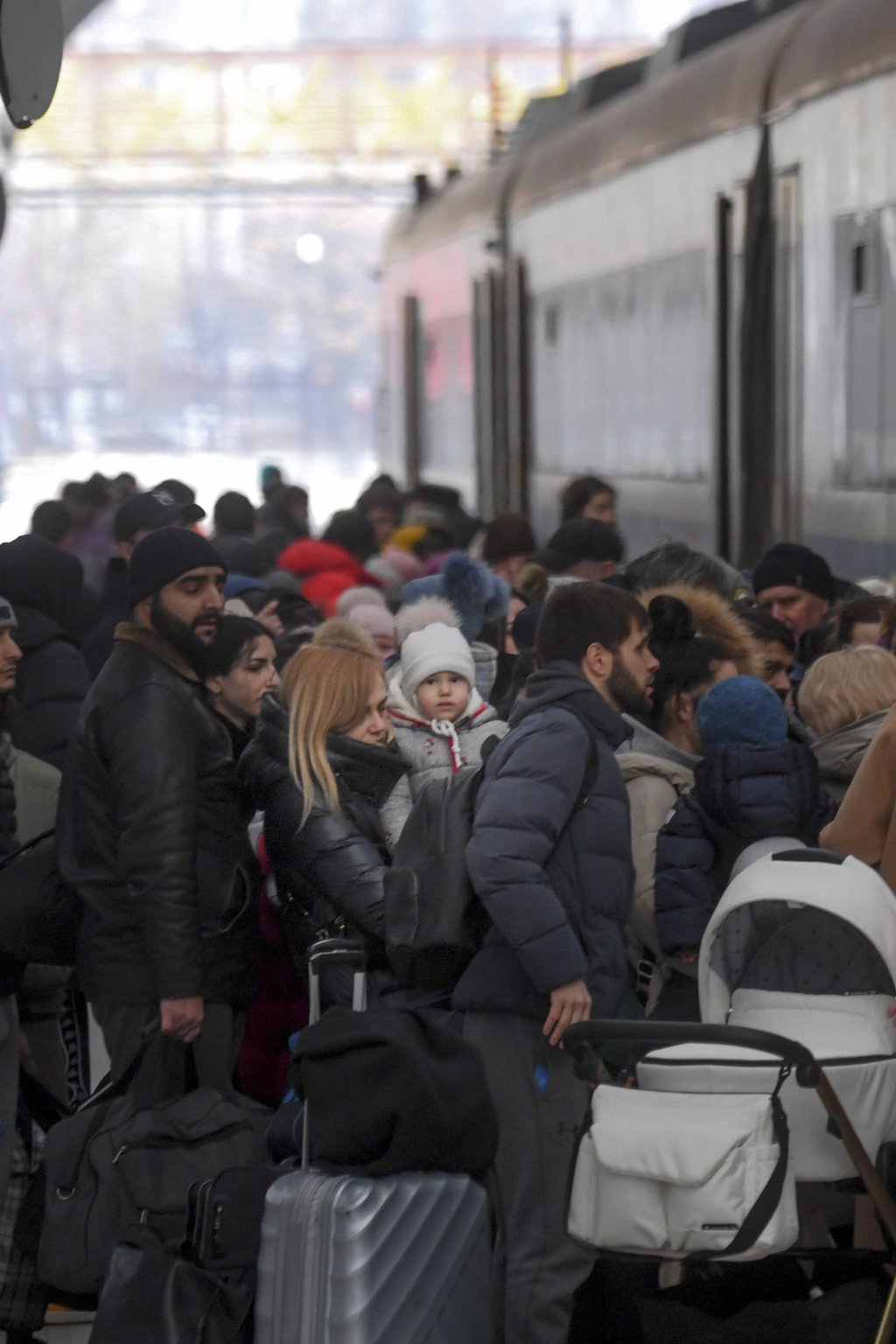 Refugees wait to enter a train to reach Romania, one of the stages of the long exodus from Ukraine, at the railway station of Chisinau, Moldova on Tuesday. Photo: EPA-EFE