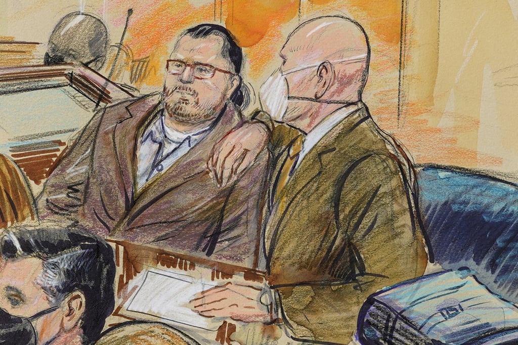 This artist sketch depicts Guy Wesley Reffitt, joined by his lawyer William Welch, right, in Federal Court, in Washington, on February 28, 2022. Reffitt was convicted of storming the US Capitol with a holstered handgun. Photo: AP