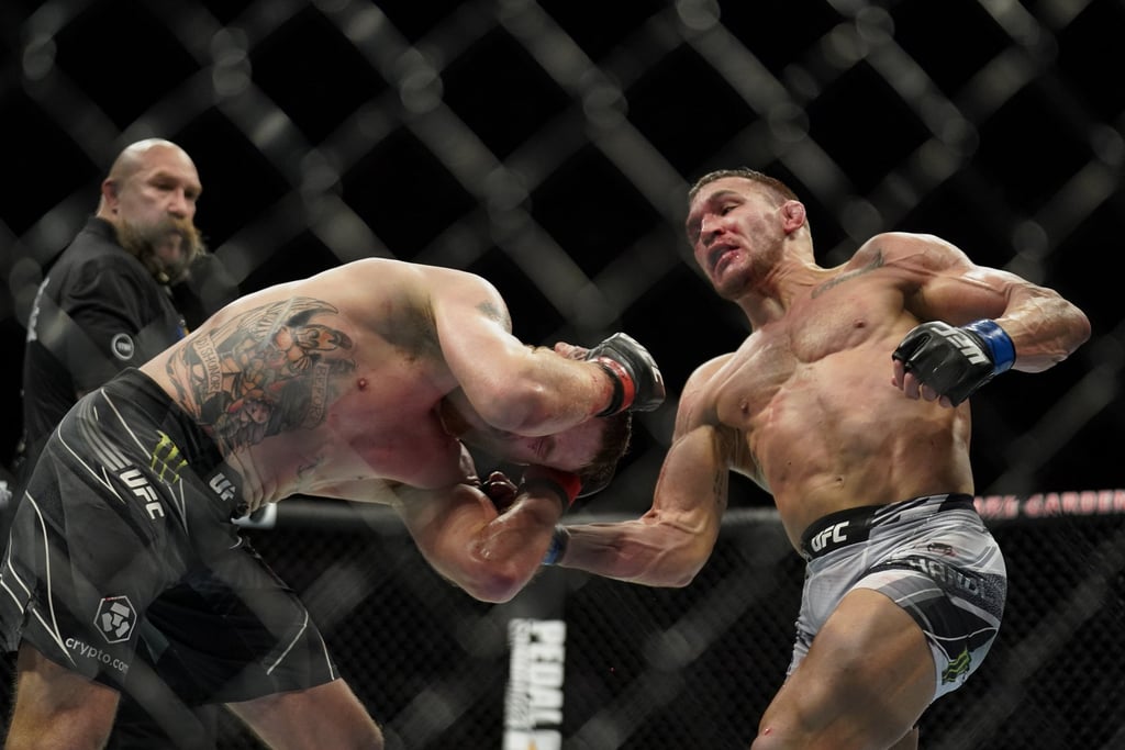 Michael Chandler (right) lands a punch against Justin Gaethje during a lightweight mixed martial arts bout at UFC 268 on November 6, 2021, in New York. Photo: AP