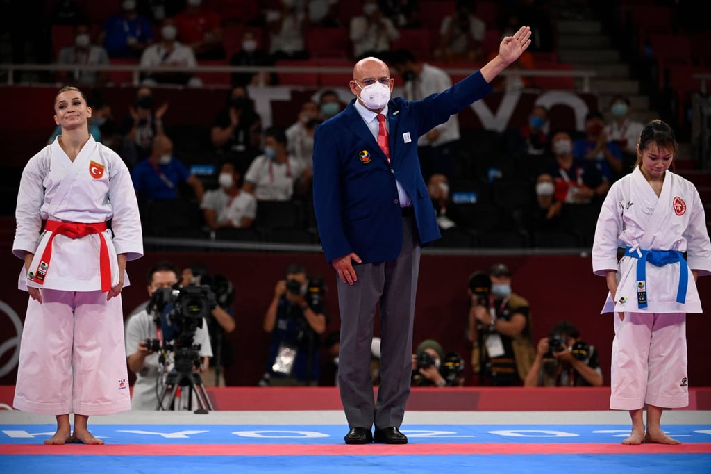 Hong Kong’s Grace Lau Mo-sheung (right) wins the Tokyo Olympics women’s individual kata bronze medal final after beating Turkey’s Dilara Bozan at the Nippon Budokan. Photo: AFP