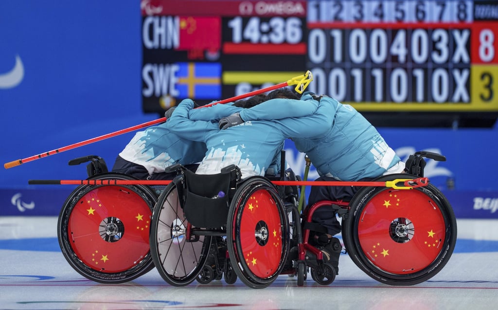 Team China celebrate after winning gold in the wheelchair curling. Photo: AP