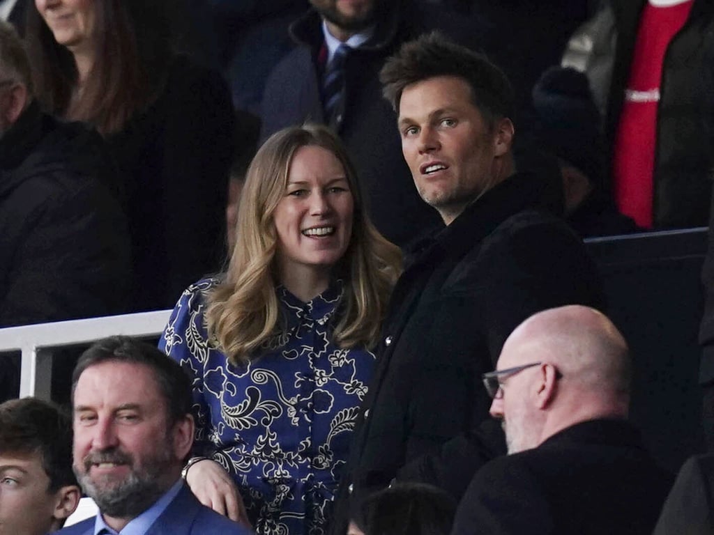 Former American football quarterback Tom Brady, right, at a football match between Manchester United and Tottenham at Old Trafford in Manchester, UK on March 12. Photo: PA via AP