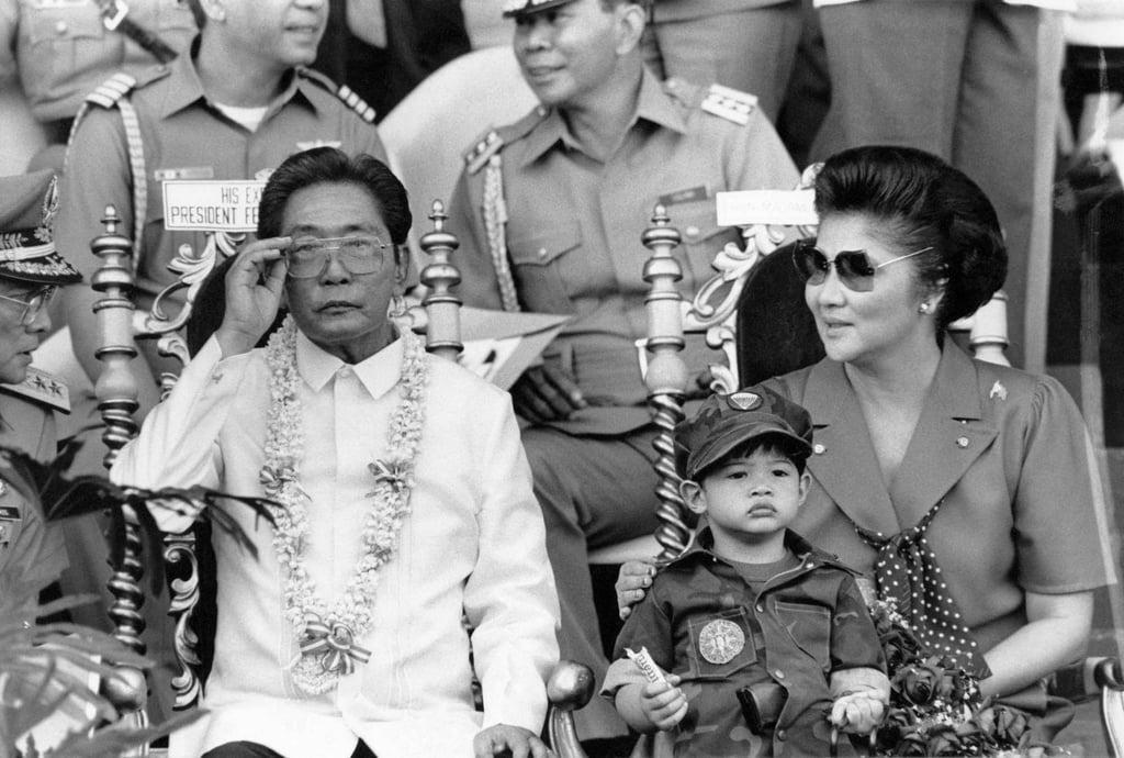 Philippine President Ferdinand Marcos and his wife Imelda (R) appearing before some 35,000 college students undergoing a two-year compulsory military training in Manila in November 1985. The son of the country’s late dictator, Ferdinand Marcos Jnr, is the clear leader in the May elections. Photo: Agence France-Presse