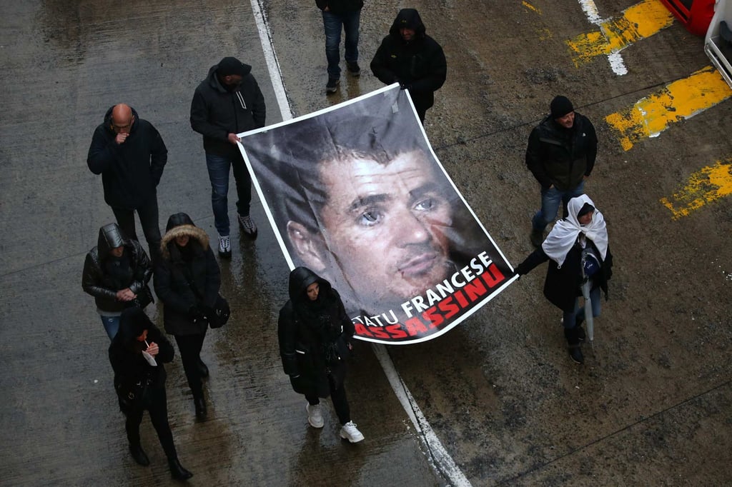 Protesters hold a poster of prisoner Yvan Colonna in Bastia, Corsica on March 13. Photo: AFP Protesters hold a poster of prisoner Yvan Colonna in Bastia, Corsica on March 13. Photo: AFP