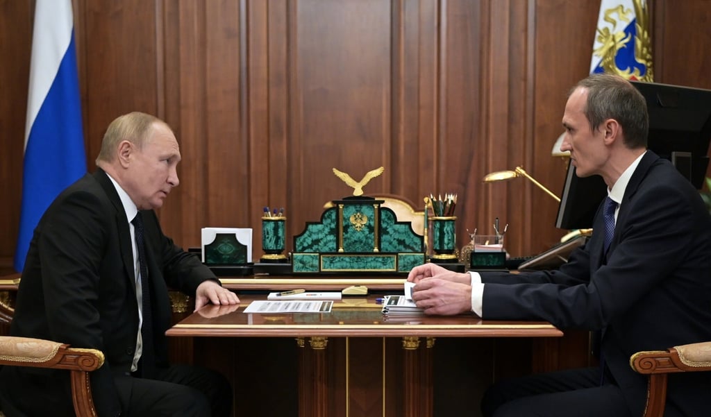 Russian President Vladimir Putin, left, with Deputy Prime Minister Dmitry Grigorenko on Monday. Photo via AP