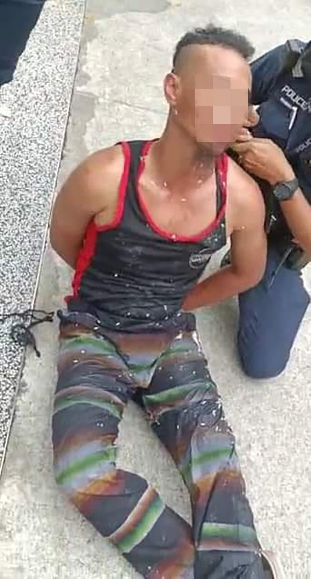 A man who was seen swinging a sword in Singapore on Monday has been arrested by police. Photo: Handout