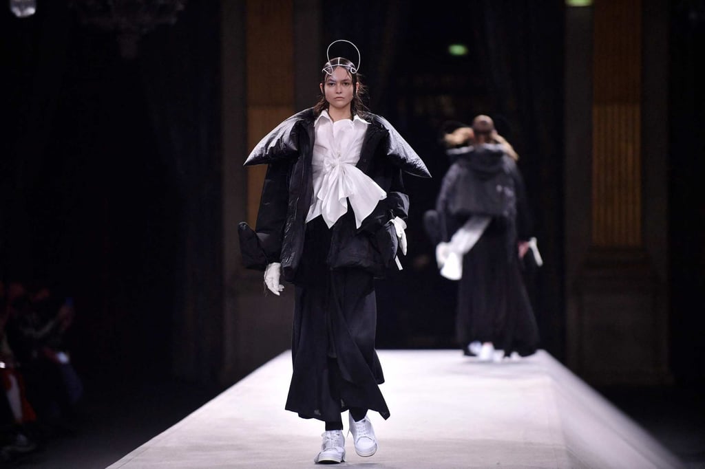 A model wears a puffed jacket with a knotted white blouse underneath at Yohji Yamamoto’s autumn/winter 2022-2023 collection fashion show during the Paris Womenswear Fashion Week, in Paris, on March 4. Photo: AFP