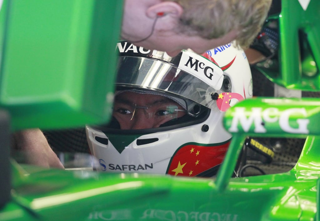 Caterham Formula One reserve driver Ma Qinghua gets ready for the first practice session at the Chinese Grand Prix in Shanghai in 2013. Photo: AP Caterham Formula One reserve driver Ma Qinghua gets ready for the first practice session at the Chinese Grand Prix in Shanghai in 2013. Photo: AP