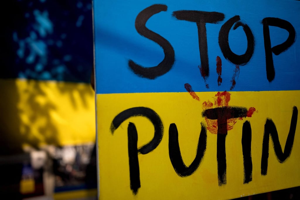 A painted sign during a demonstration against Russia’s invasion of Ukraine. Photo: AFP A painted sign during a demonstration against Russia’s invasion of Ukraine. Photo: AFP