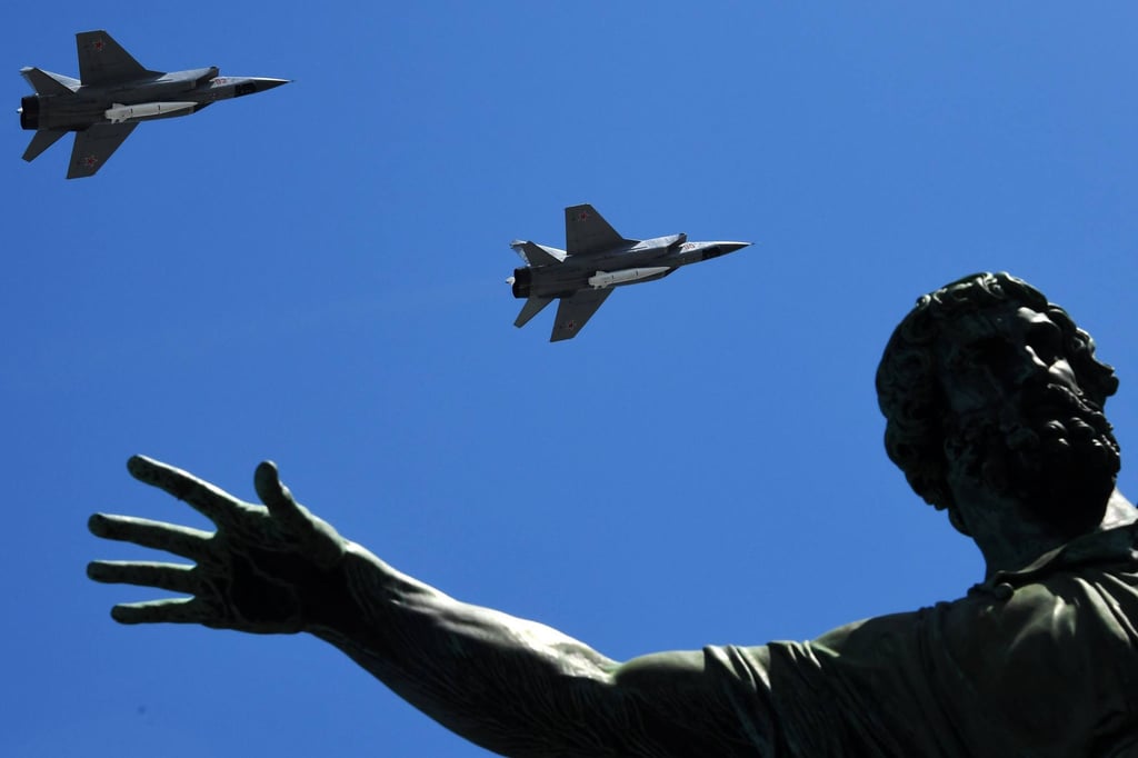 Russia’s MiG-31 supersonic interceptor jets carrying hypersonic Kinzhal (Dagger) missiles fly over Red Square. Photo: AFP