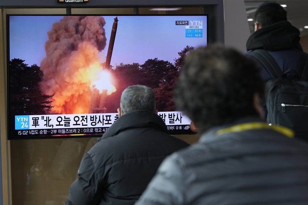 North Korean’s watch a news programme showing a file image of a rocket launch on Sunday, March 20. Photo: AP North Korean’s watch a news programme showing a file image of a rocket launch on Sunday, March 20. Photo: AP