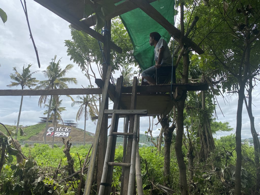 Sibawai’s 3.5 metre-tall makeshift seat overlooks an ITDC-branded hill inside the race track. Photo: Resty Woro Yuniar Sibawai’s 3.5 metre-tall makeshift seat overlooks an ITDC-branded hill inside the race track. Photo: Resty Woro Yuniar