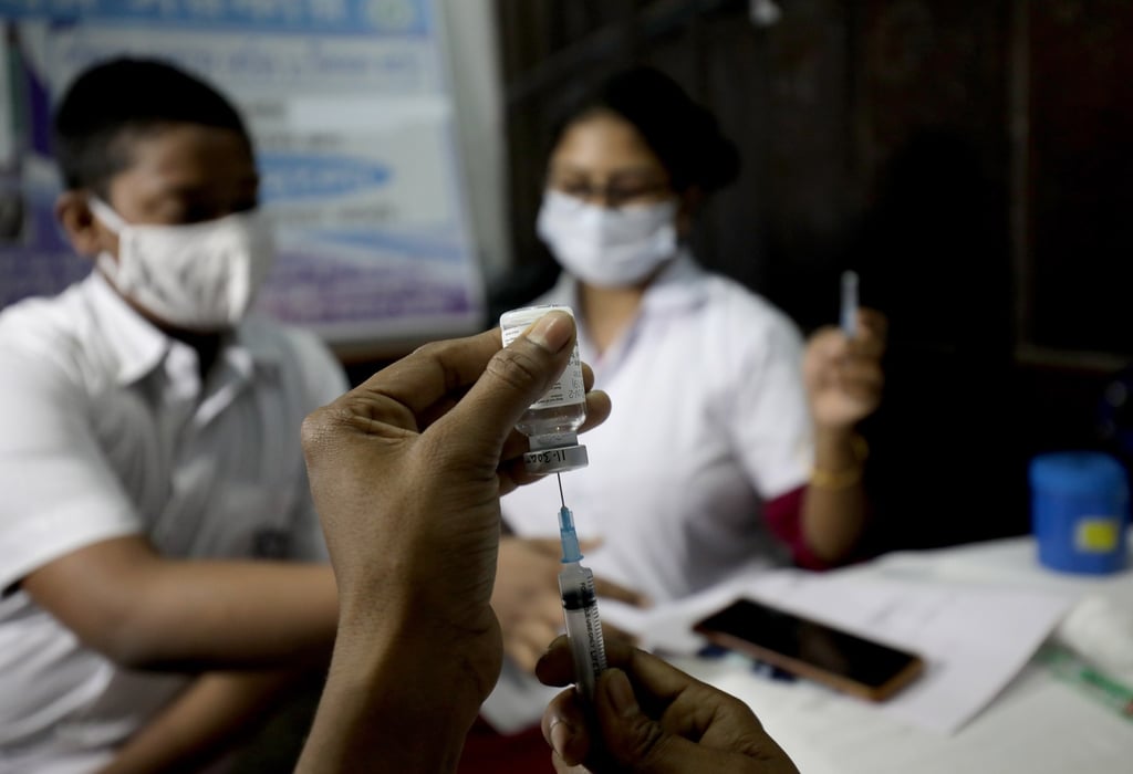 A student in India waits to receive a Covid-19 vaccine on Monday. Photo: EPA-EFE