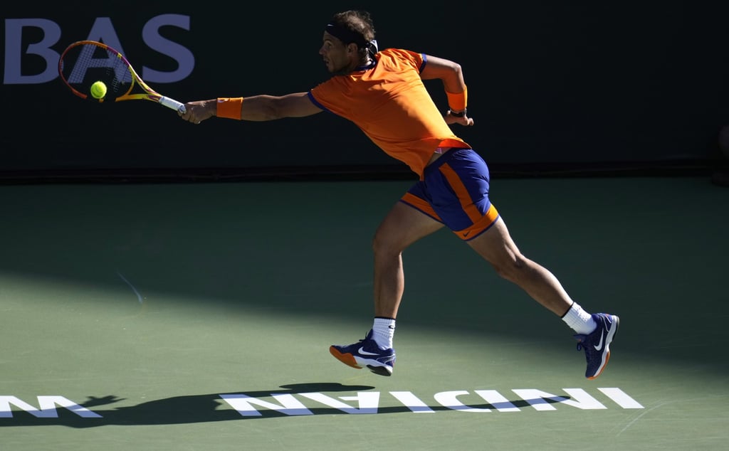 Rafael Nadal hits a return to Taylor Fritz at the Indian Wells Tennis Garden. Photo: EPA-EFE